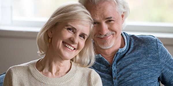 Senior couple smiling after cataract treatment